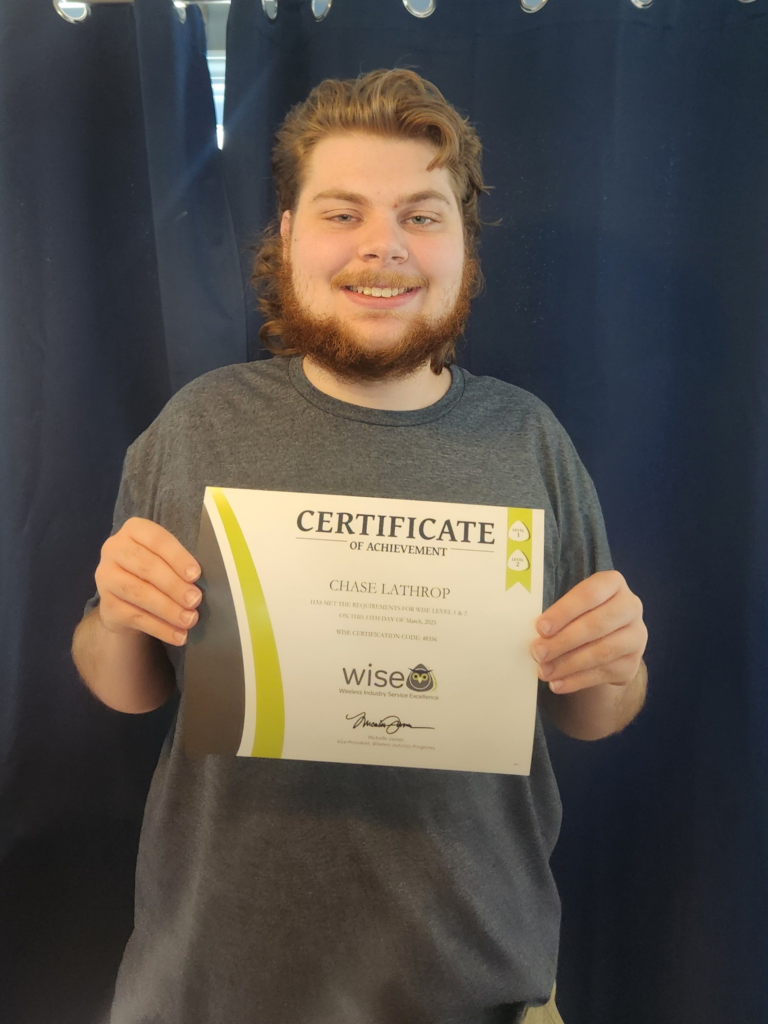 Image of Chase holding up his. Wise certification for level one and level two that means he's a certified mobile repair technician.